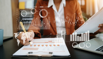 Businessman hand Project manager working and update tasks and Gantt chart scheduling virtual diagram.with smart phone, tablet and laptop