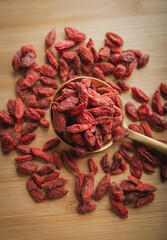 Goji berries on a wooden background