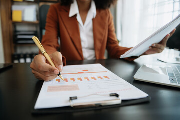 African businesswoman hand working with new modern computer using on smartphone and tablet as...