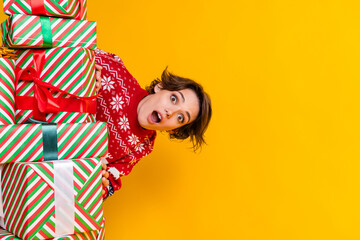 Photo of impressed funky girlish girl dressed red knit sweatshirt look out gifts astonished staring isolated on yellow color background