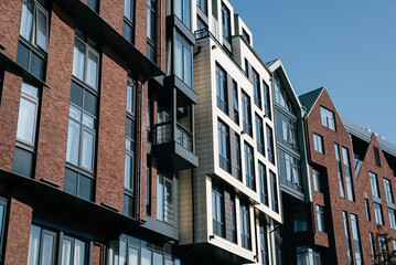 Fototapeta premium Modern apartment building in Scandinavian style, exterior on a sunny day