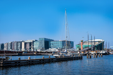 Amsterdam, Netherlands - March 29, 2022: NEMO science center of Amsterdam. Maritime museum near Amsterdam Centraal Station. Futuristic building exterior at a sunny day in summer. - obrazy, fototapety, plakaty