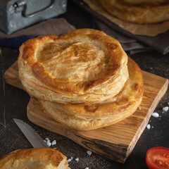 Rustico puff pastry from Lecce filled with stuffed with tomato, mozzarella and bechamel sauce