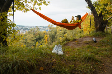 chilling woman laying down in hammock