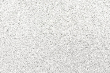 White seamless concrete pebble wall background or texture.