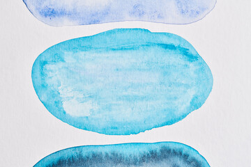 Abstract blue background. Watercolor ink multicolor art collage. Stains, blots and brush strokes of acrylic paint on white paper.