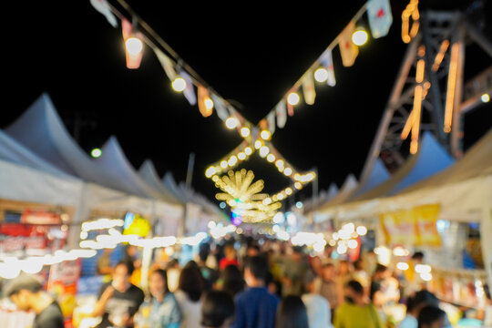 Fototapeta Blurred image of night market with people background, bokeh.(vintage sound)