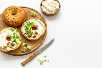 Set of fresh bread bagels with cheese cream. Healthy breakfast background