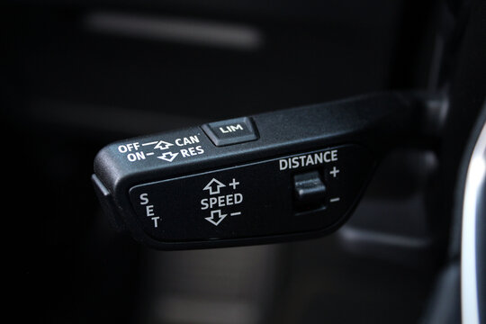Cruise control switch. Car detail. Modern car interior. Speed limitation and cruise control buttons on modern car