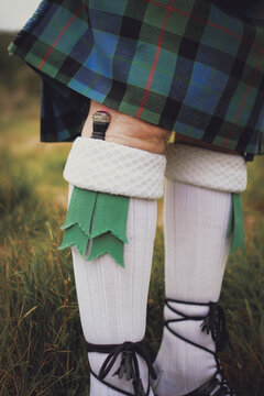 Man wearing a sgian dubh - part of a traditional highland wear outfit at wedding