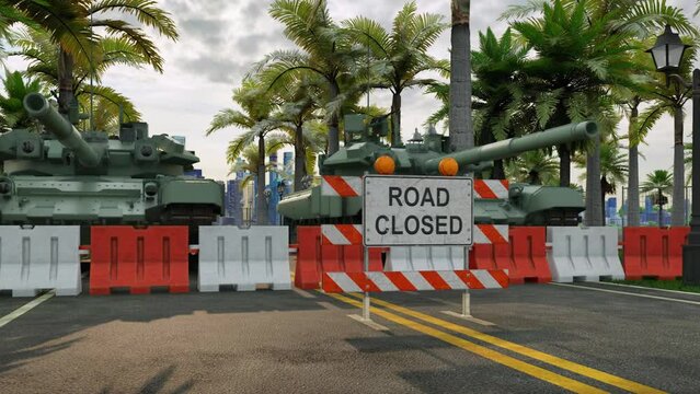 Two military armored tanks in front of heavy-duty bollards and a large 'road closed' sign, blocking a main road into and out of a city.