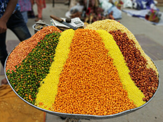 Colorful street stall with ingredients to make popular snack in India