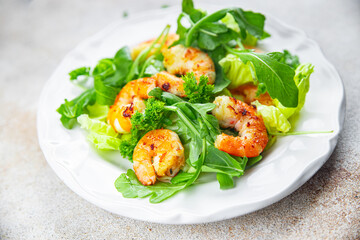 shrimp salad prawn fresh seafood shrimps and arugula appetizer meal Pescetarian food snack on the table copy space food background rustic top view 
