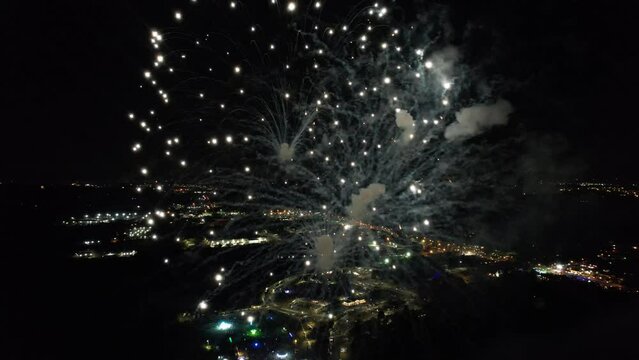 A personal drone flies through a fireworks celebration during the United States Fourth of July celebration