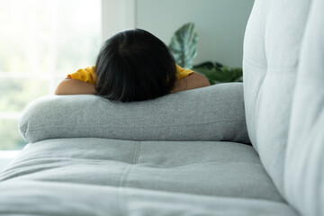 little asian children kid playing hide and seek standing behind the sofa, Adorable child having fun in the home. happy family have fun with kids, activity, learning, activity, game, meditation