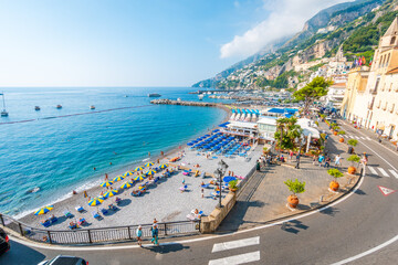 Amalfi Coast view of the beach with the umbrellas and the curved road in the foreground