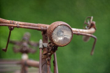Old decay bicycle on green vine climbing garden wall outdoor. Rust Classic bike old bicycle on green garden wall retro style. Vine plant green leaves partition background.