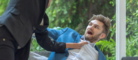 Woman punch hit to man in suit after company meeting. Complain and argue conflict in teamwork from discuss and argue mad if punch attack in office. © BESTIMAGE