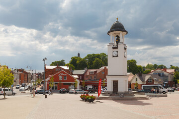 Telsiai, Lithuania - July 9, 2023: Old town square with clock tower - obrazy, fototapety, plakaty
