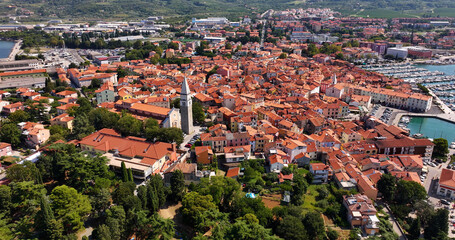 Aerial view of Izola, Church of St. Maurus, Gothic bell tower, a town in southwestern Slovenia on the Adriatic coast of the Istrian peninsula