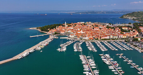 Aerial view of the old fishing town, Izola, on an impressive summer day in Slovenia, Europe....