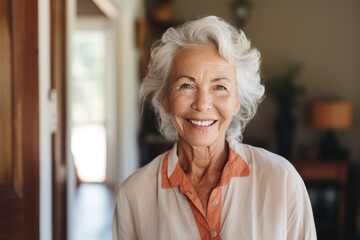 Fototapeta na wymiar Smiling portrait of a senior woman in her home