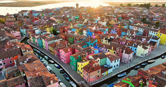 Aerial view of the colorful houses of the Burano Island, in the Venice province, Veneto region, Italy, sunrise golden hour