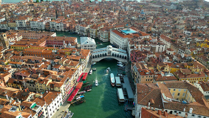Venice, Aerial view of Rialto bridge crossing the Grand Canal in Venice downtown, Veneto, Italy