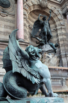 Saint Michel terrassant le Demon statue by French sculptor Francisque Joseph Duret that is located on Fontaine Saint-Michel in Paris, France 