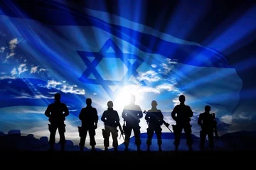Foto op Canvas Silhouette of soldiers against the background of the flag of Israel © Anna