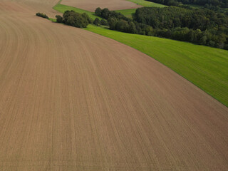 Brown agriculture field with soil in the countryside 