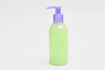 bottle with green shower gel isolated on white background