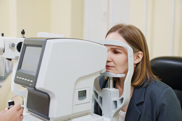 Middle-aged woman in ophthalmologist's office.