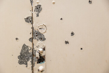Chernihiv region. Russian invasion of Ukraine. Bullet holes in the metal door of the residential...