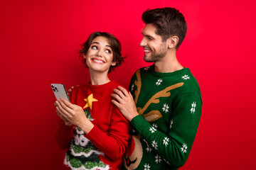 Photo of positive lady guy using device buying gifts on season xmas discounts isolated on vivid color background