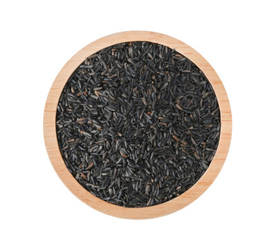 niger seed (Guizotia abyssinica) in wood bowl on transparent png. Top view.