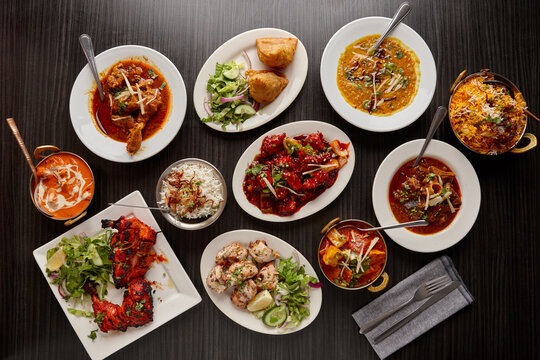 Overhead view of Indian dishes on table