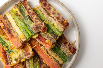 Korean holiday food skewers Jeon on white background