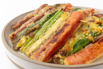 Korean holiday food skewers Jeon on white background