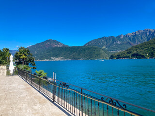 View on Lake Lugano with Mountain in a Sunny Summer Day in Morcote, Ticino, Switzerland.