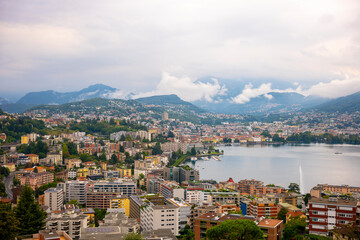 Cityscape and Mountain and Lake Lugano in a Cloudy Day in Ticino, Switzerland.