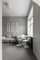 Apartment with white chairs and round wooden, white table