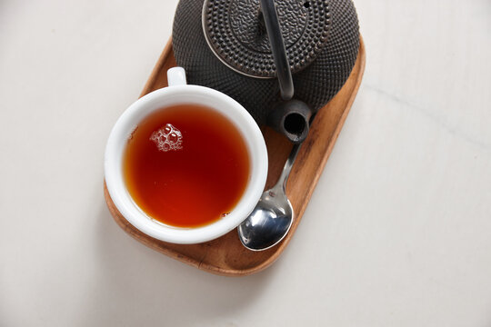 Fresh cup of tea served on table