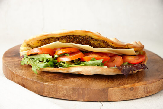 close up shot of cheese and tomato zaatar