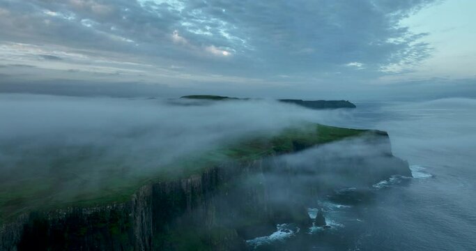 Flying in the clouds above the Cliffs of Moher 4k