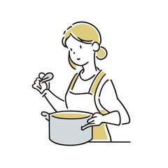 エプロンを着て料理をする女性