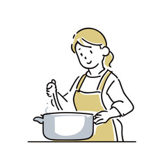 エプロンを着て料理をする女性