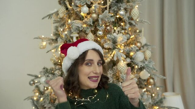 woman calls her friends via video conference call wishing Merry Christmas
