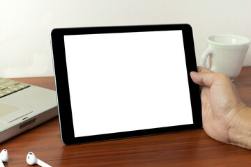 Hands holding black tablet, isolated on white background,  business using digital tablet, close up hands multitasking man using tablet, laptop and cellphone connecting, Young smart busy professional b