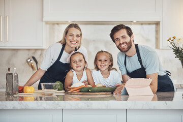Obraz na płótnie Canvas Smile, portrait and family cooking in kitchen together for bonding and preparing dinner, lunch or supper. Happy, love and girl children with vegetables or ingredients with parents for meal at home.